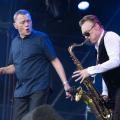 Duncan Campbell (left) and Brian Travers of UB40 perform live onstage during the Rewind Scotland festival at Scone Palace on July 22, 2018 in Perth, Scotland. The saxophonist died Sunday at 62.